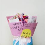 a bouquet with cards for the teachers day